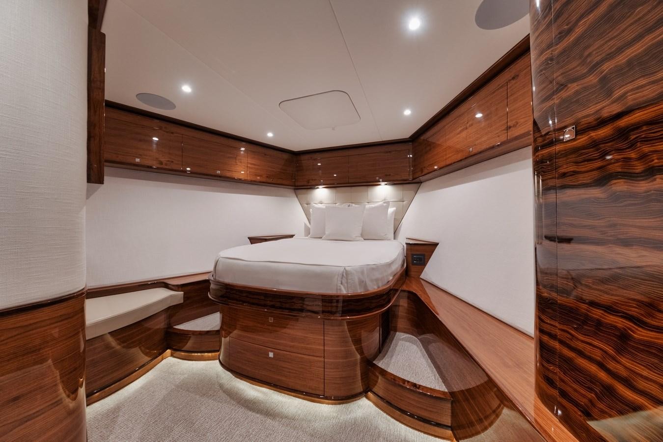 a room with a bed and a mirror aboard JARUCO Yacht for Sale