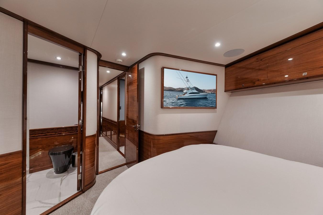 a bedroom with a large bed aboard JARUCO Yacht for Sale