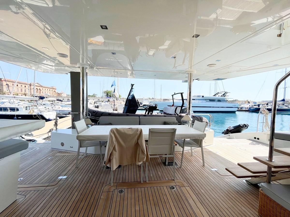 a room with a table and chairs aboard BLUE DEER Yacht for Sale