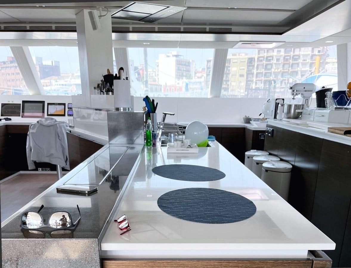 a kitchen with a large island aboard BLUE DEER Yacht for Sale