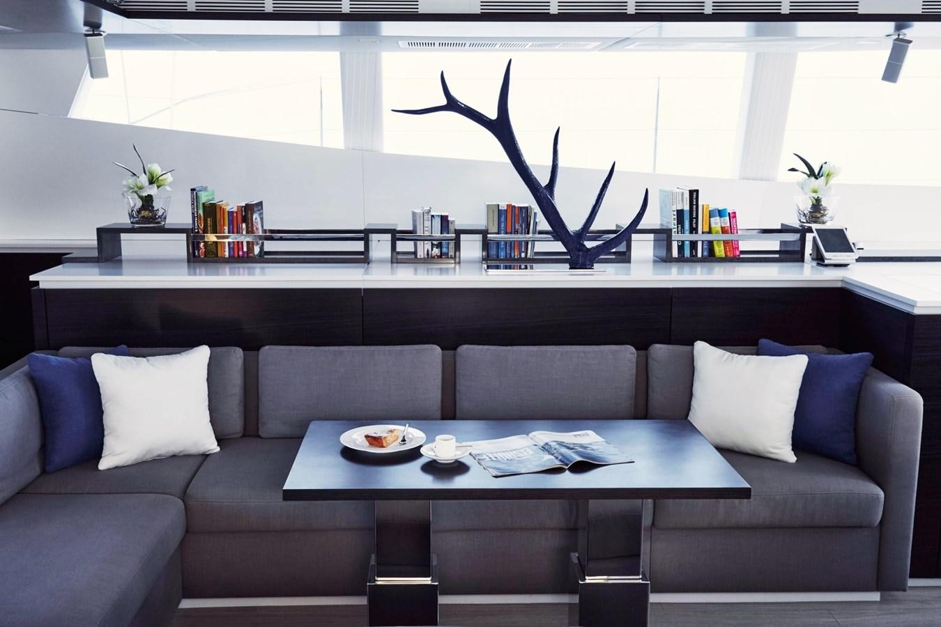 a living room with a couch and a table aboard BLUE DEER Yacht for Sale