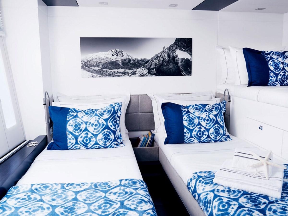 a couple of beds in a room aboard BLUE DEER Yacht for Sale