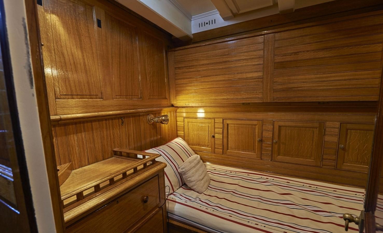 a room with wooden cabinets aboard SUMURUN Yacht for Sale