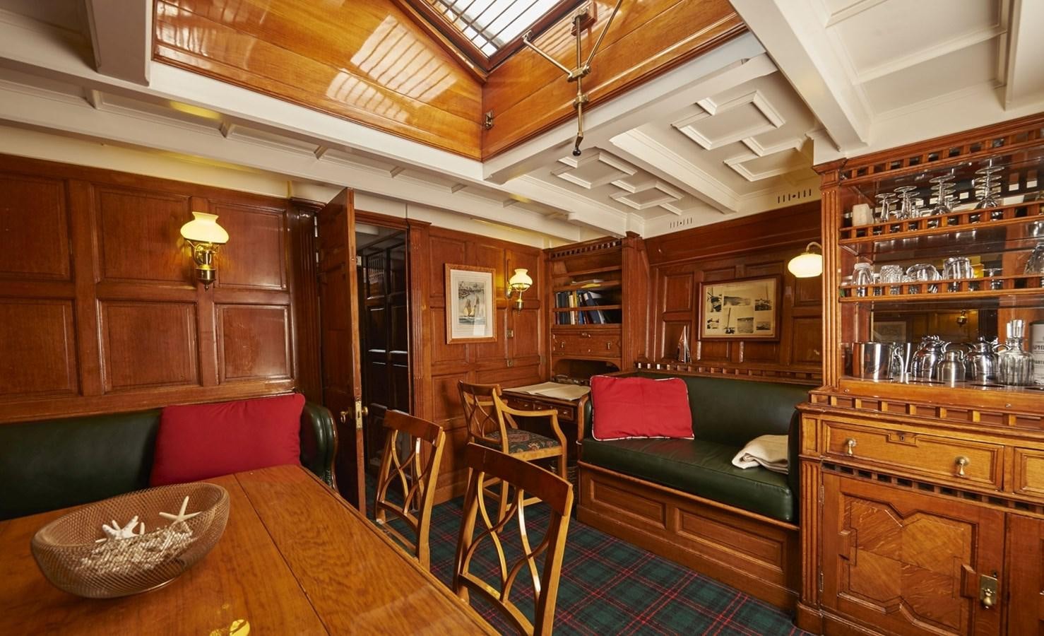 a room with a couch and a table aboard SUMURUN Yacht for Sale