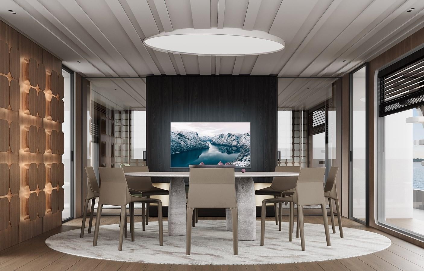 a room with a table and chairs aboard DYNAMIQ GLOBAL 550 Yacht for Sale