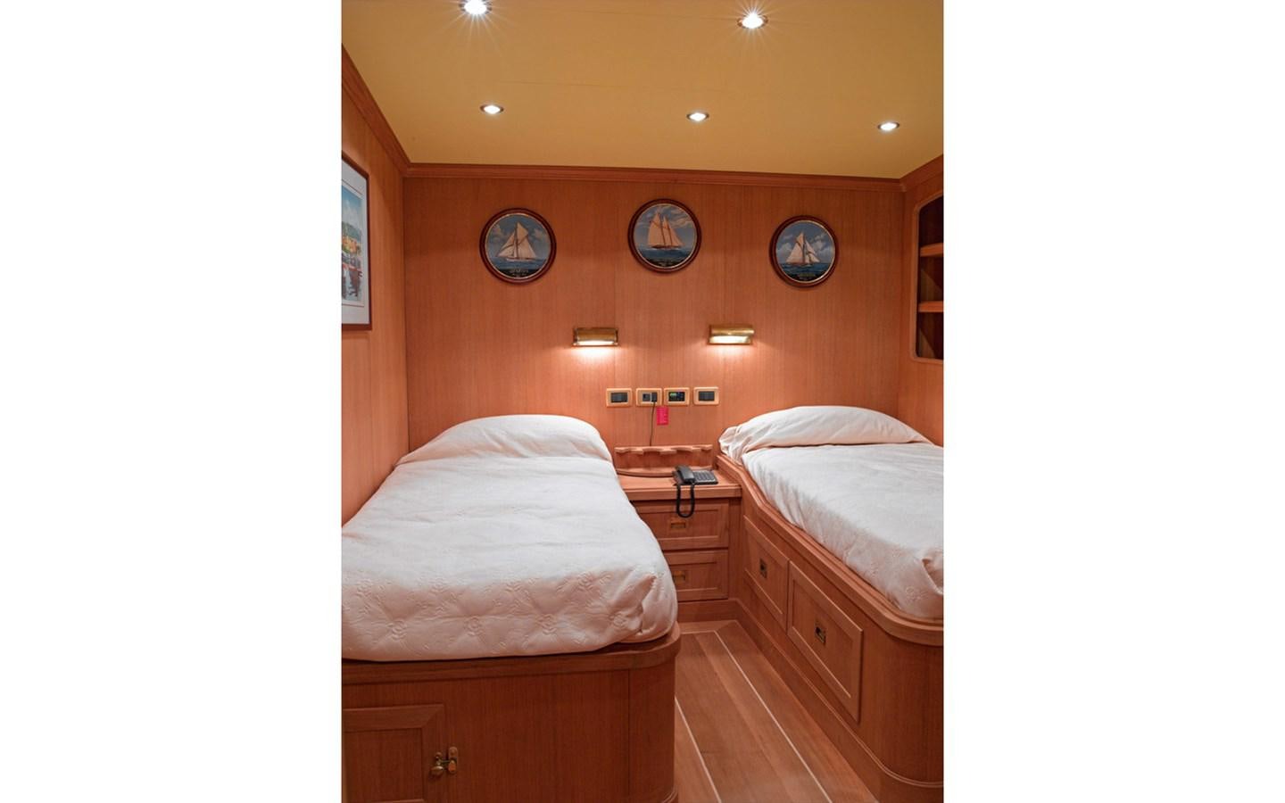 a room with two beds aboard SAN GENNARO Yacht for Sale