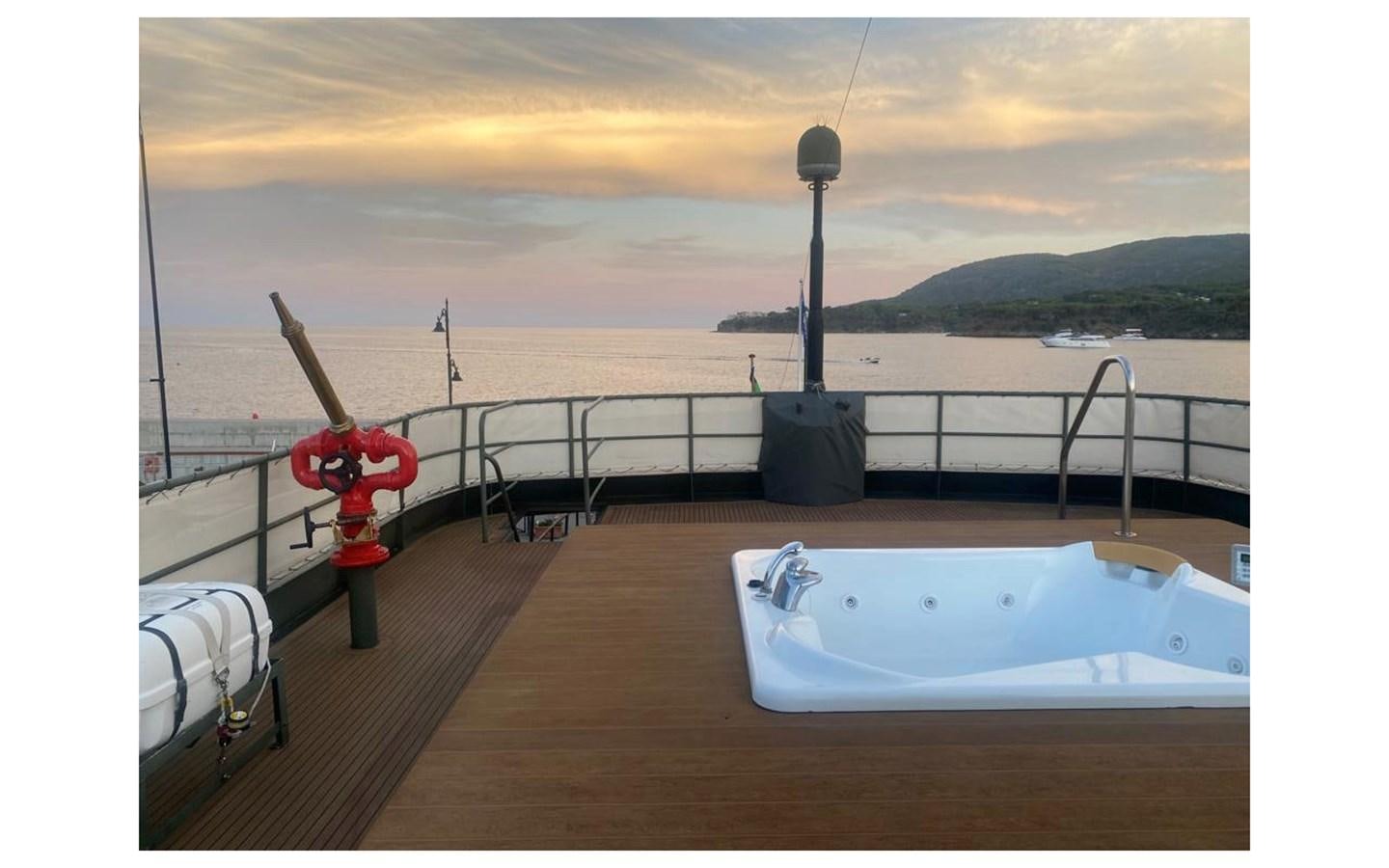 a deck with a large white pool and a fire hydrant on it aboard SAN GENNARO Yacht for Sale