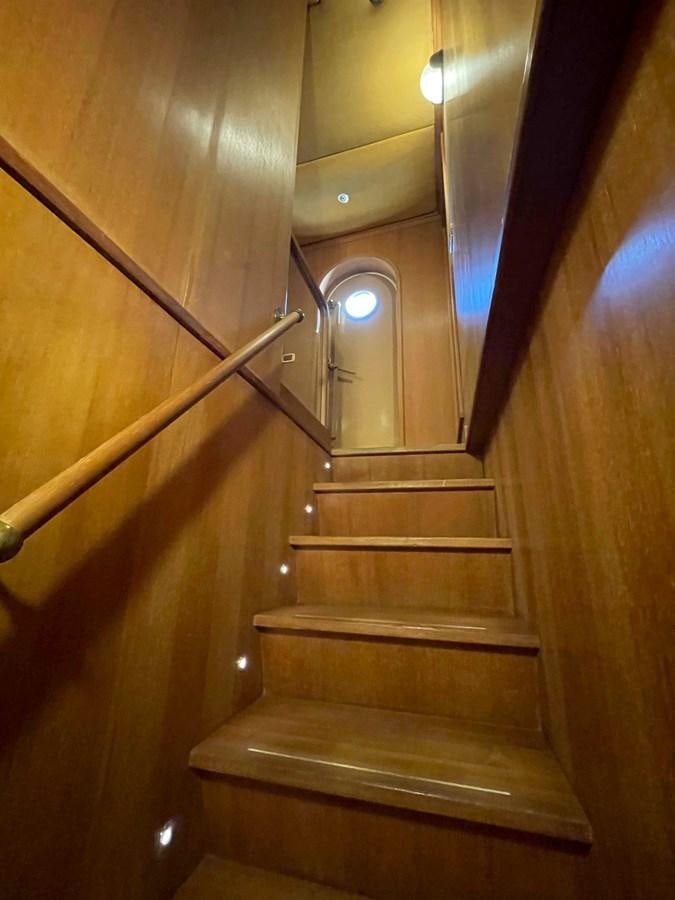 a staircase with a light on the side aboard SAN GENNARO Yacht for Sale