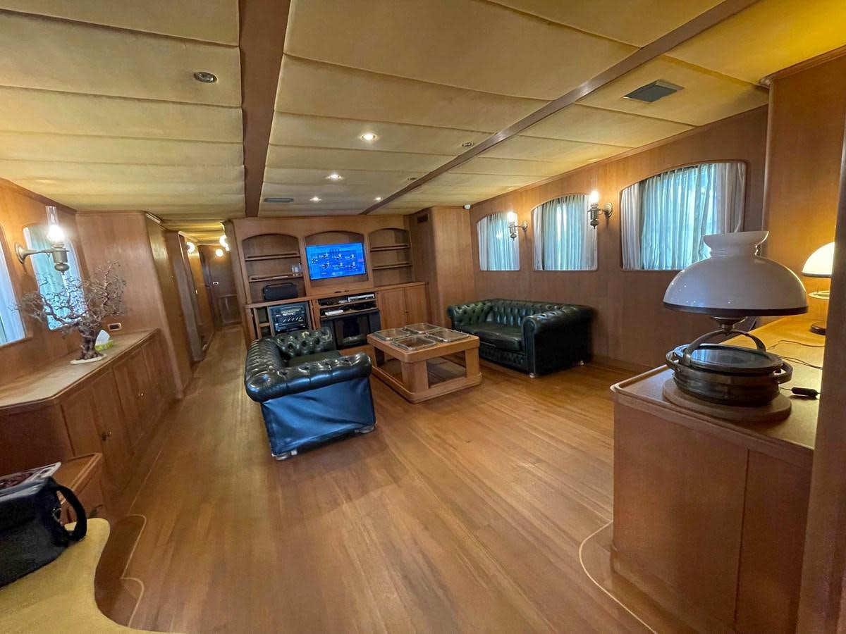 a living room with a large fireplace aboard SAN GENNARO Yacht for Sale