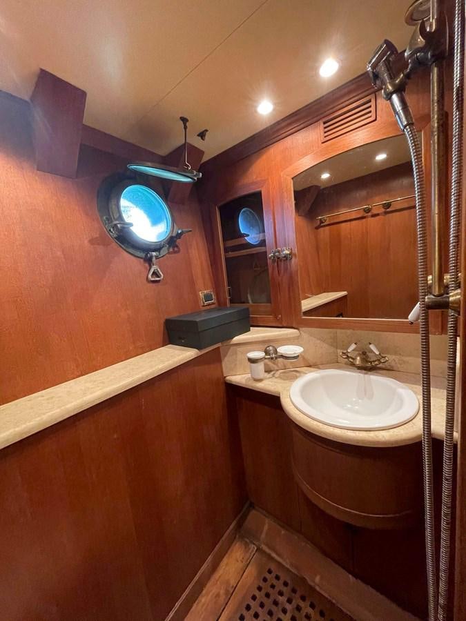 a bathroom with a sink and a mirror aboard SAN GENNARO Yacht for Sale