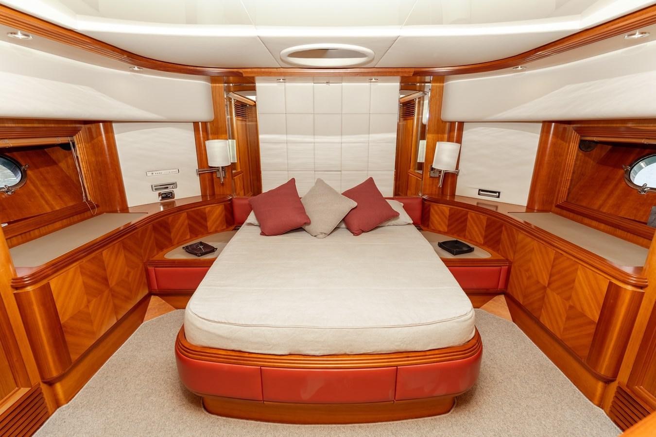 a room with a bed and a desk aboard CINQUE LUNE Yacht for Sale