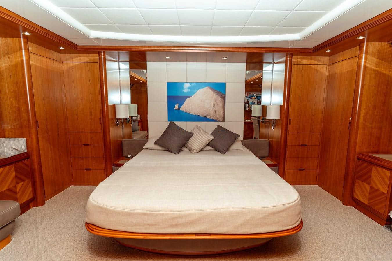 a large bed in a room aboard CINQUE LUNE Yacht for Sale