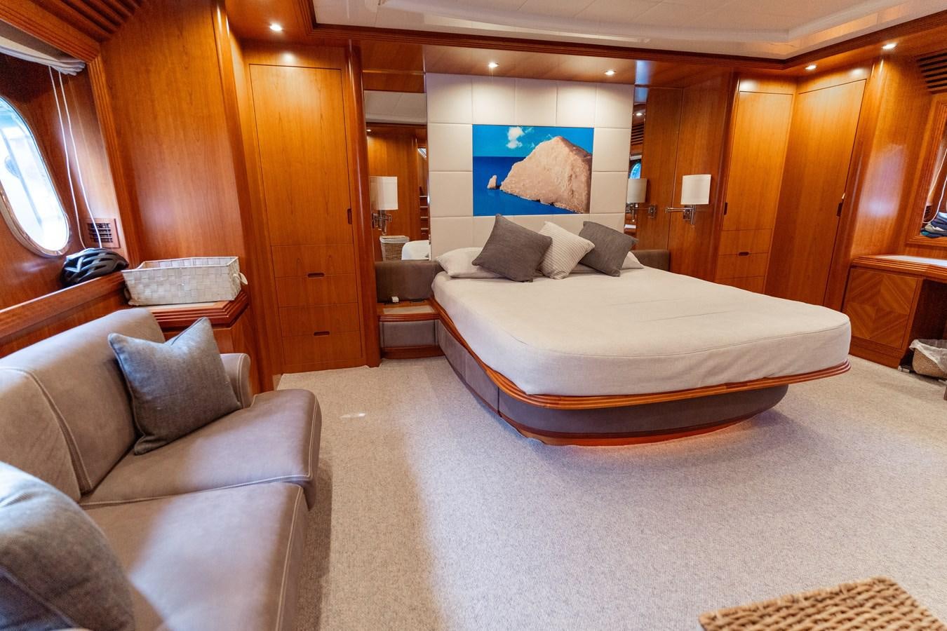 a hotel room with a bed and a couch aboard CINQUE LUNE Yacht for Sale