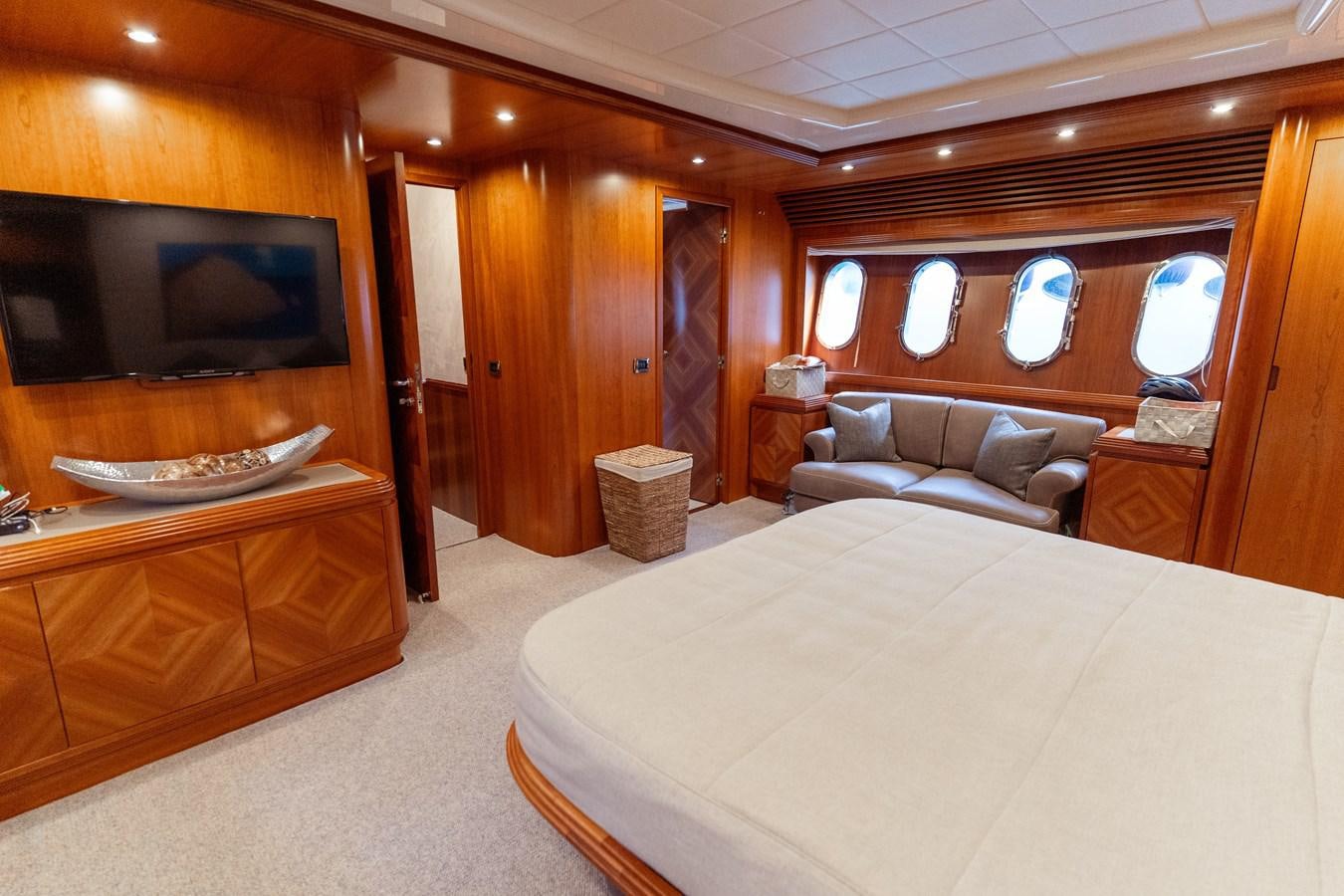 a bedroom with a bed and a television aboard CINQUE LUNE Yacht for Sale