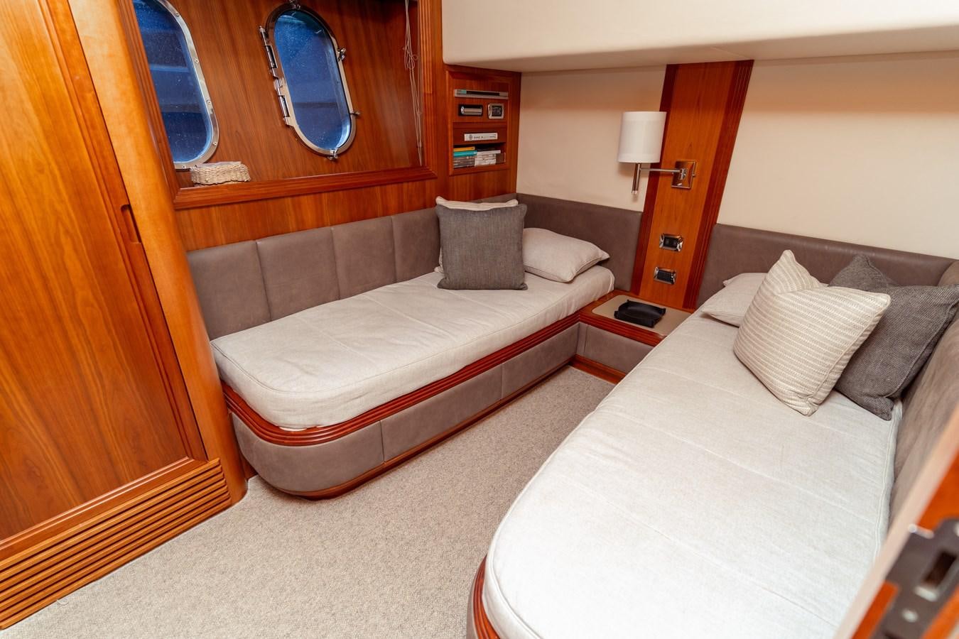 a room with two beds aboard CINQUE LUNE Yacht for Sale