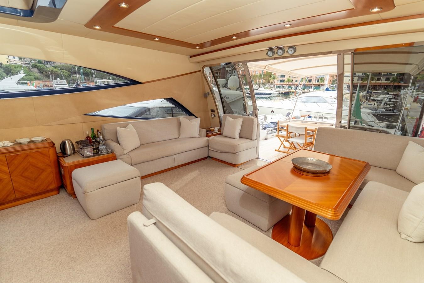 a living room with a large window aboard CINQUE LUNE Yacht for Sale