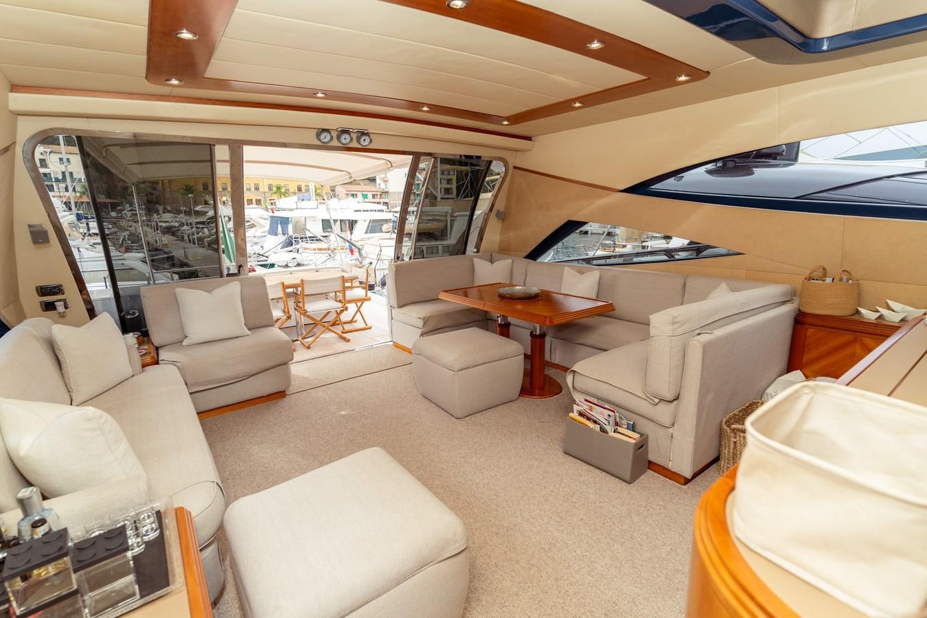a living room with a large window aboard CINQUE LUNE Yacht for Sale