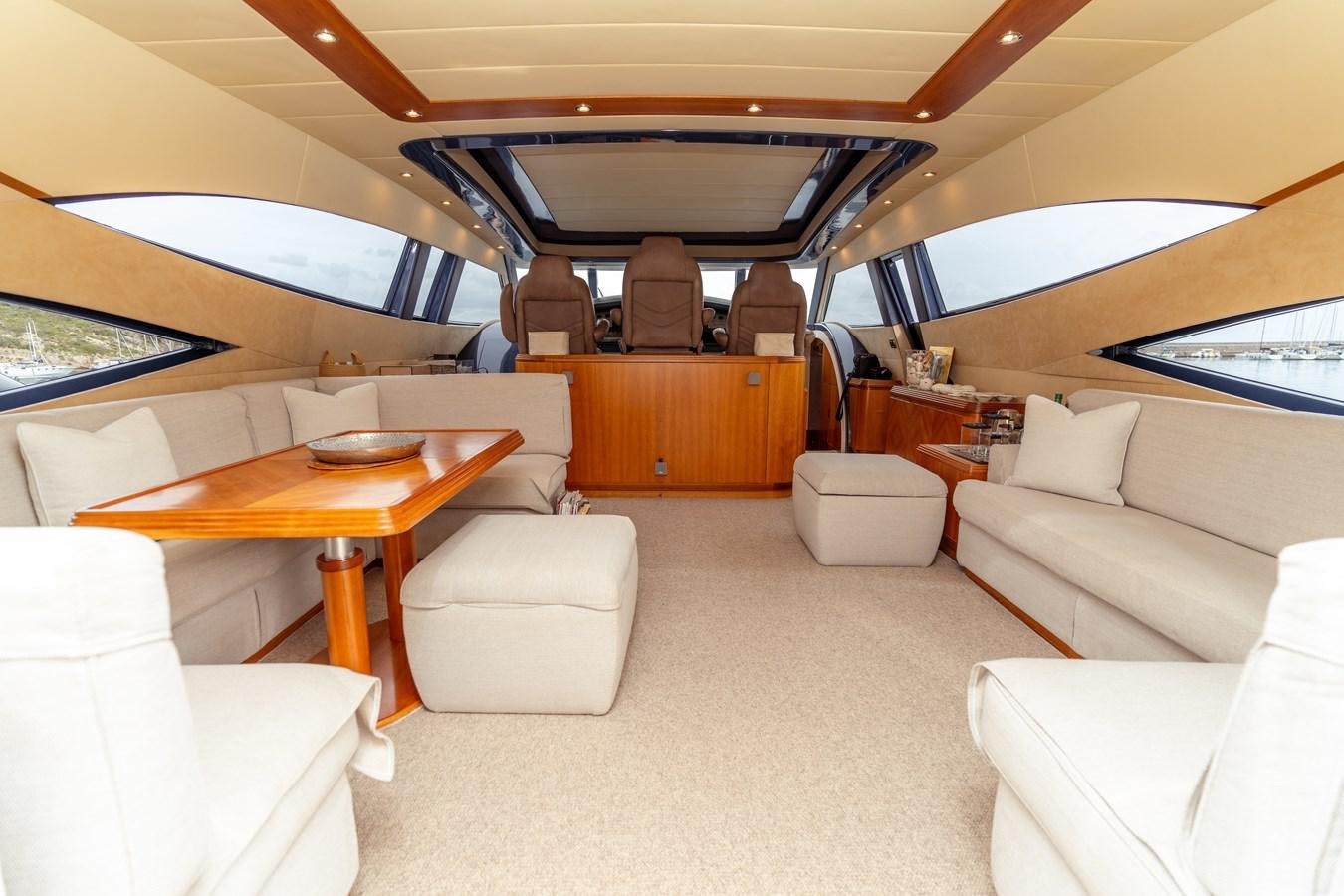 a room with a table and chairs aboard CINQUE LUNE Yacht for Sale