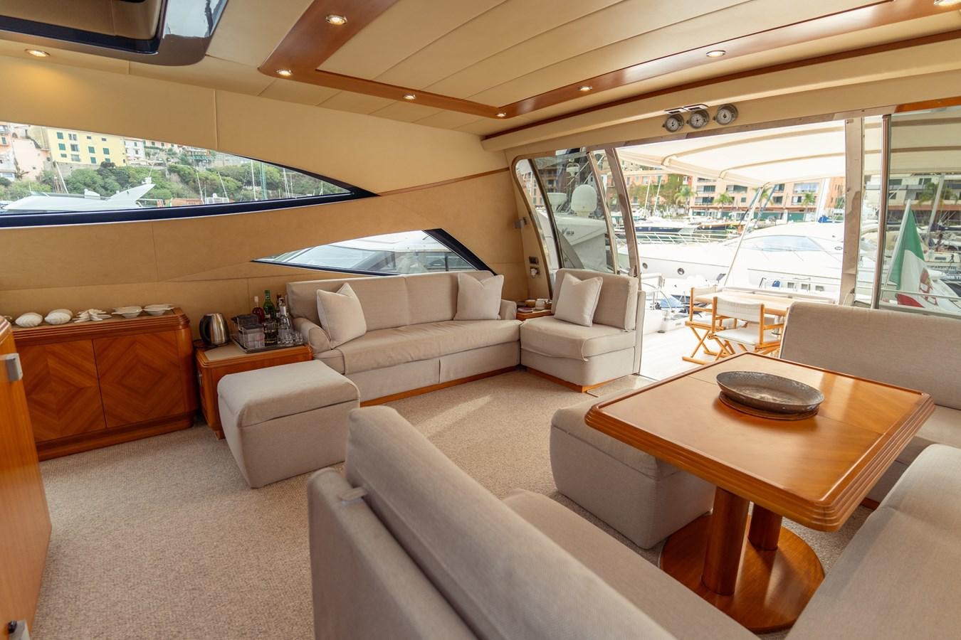 a living room with a large window aboard CINQUE LUNE Yacht for Sale