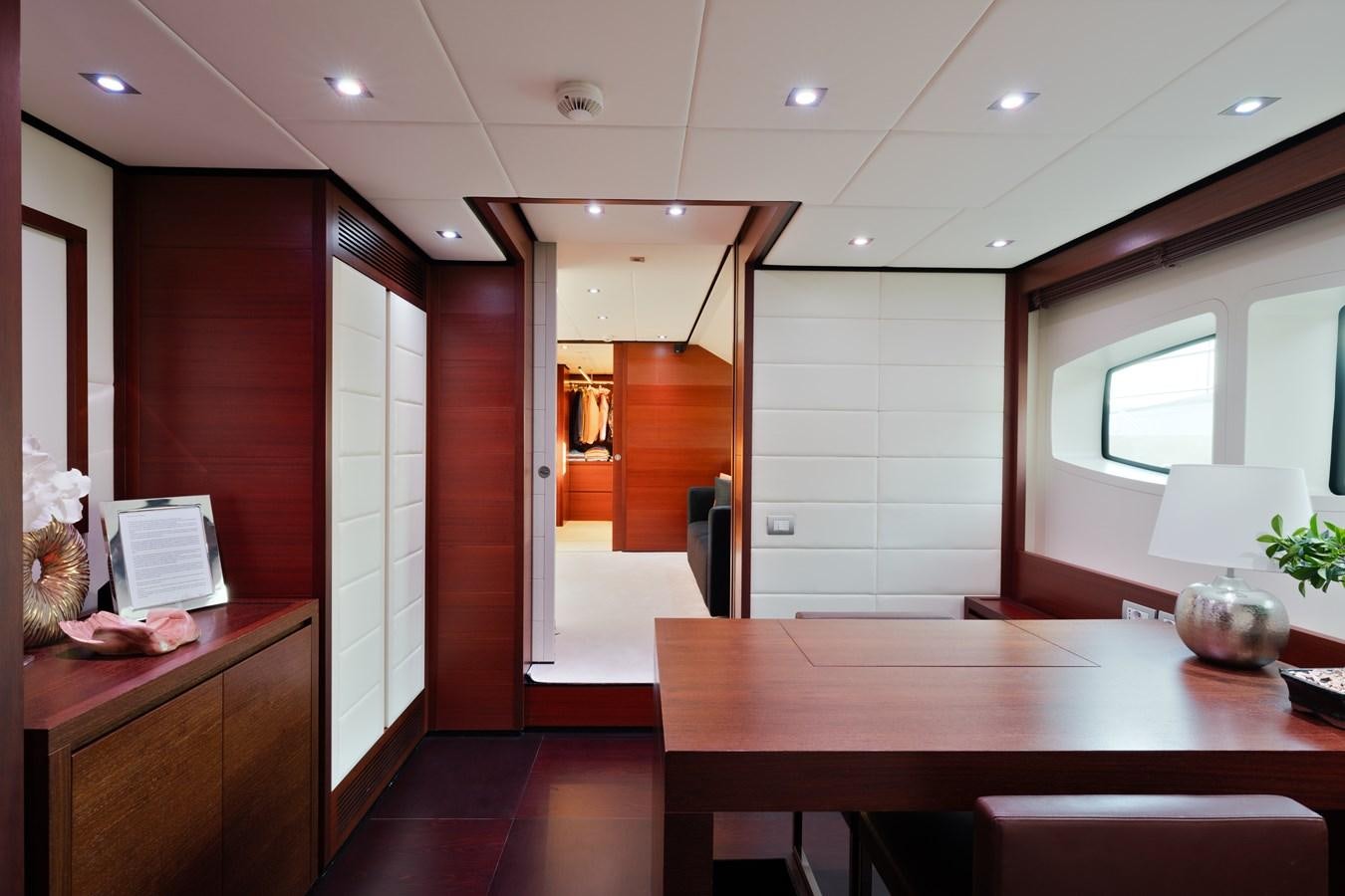 a room with a table and chairs aboard ANNAMIA Yacht for Sale