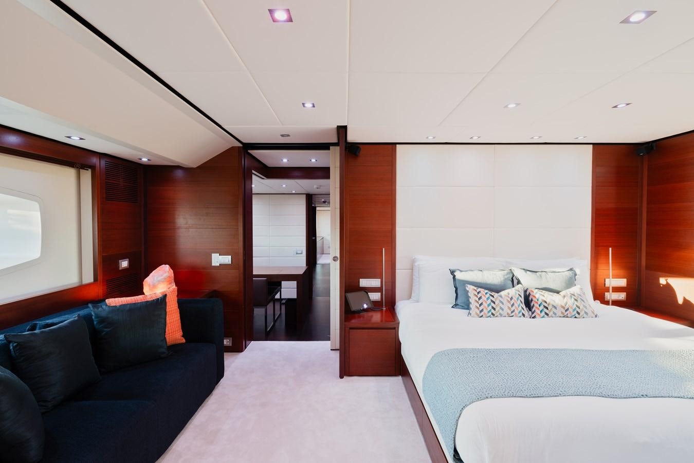 a room with a bed and a couch aboard ANNAMIA Yacht for Sale