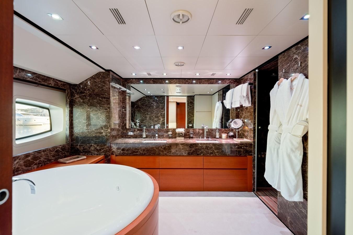 a bathroom with a large bathtub aboard ANNAMIA Yacht for Sale