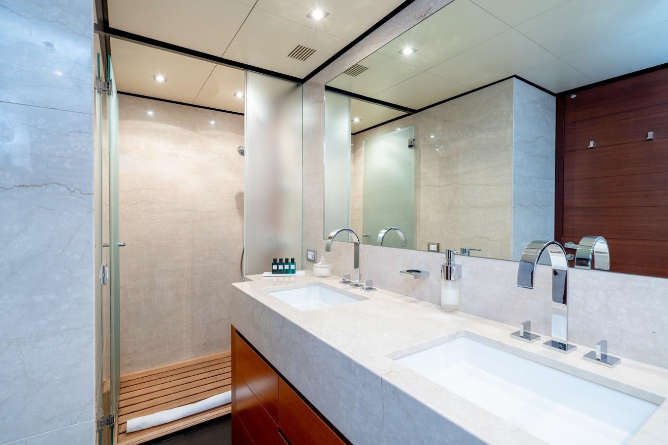 a bathroom with a large mirror aboard ANNAMIA Yacht for Sale