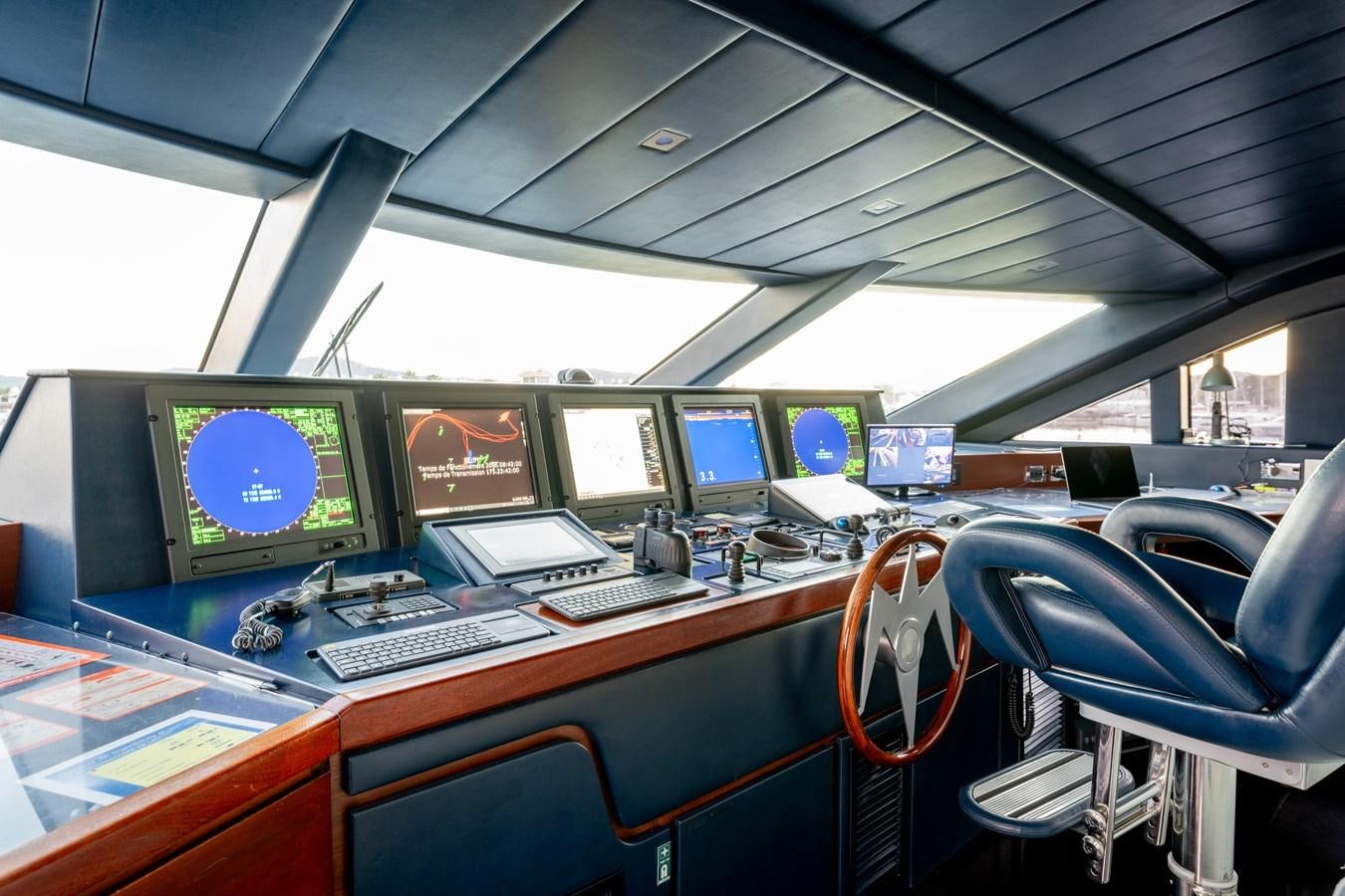 a row of computers on a train aboard ANNAMIA Yacht for Sale