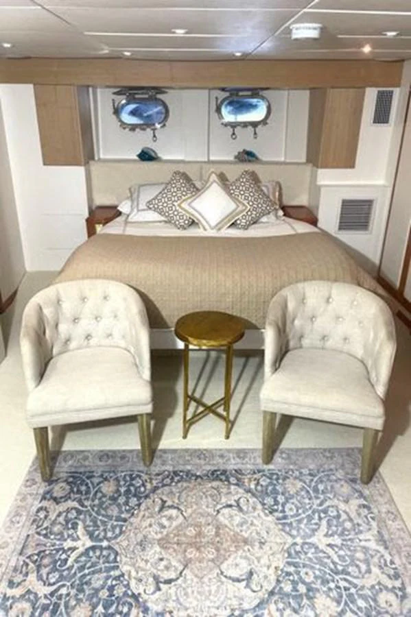 a room with chairs and a table aboard ROGUE Yacht for Sale