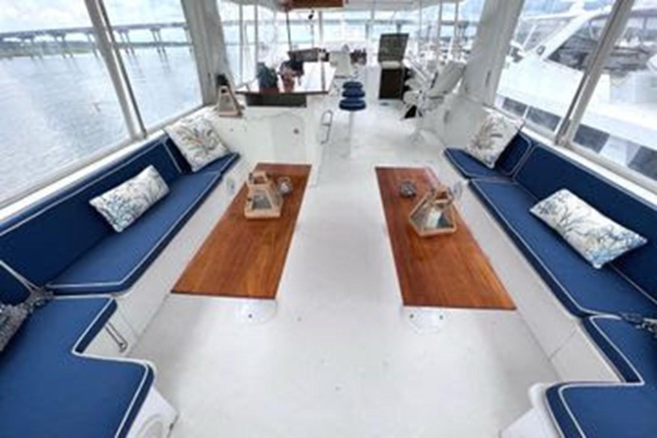 a room with a table and chairs aboard NORTHER VENTURE Yacht for Sale