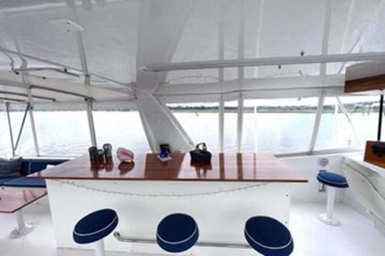a white tent with a table and chairs aboard NORTHER VENTURE Yacht for Sale