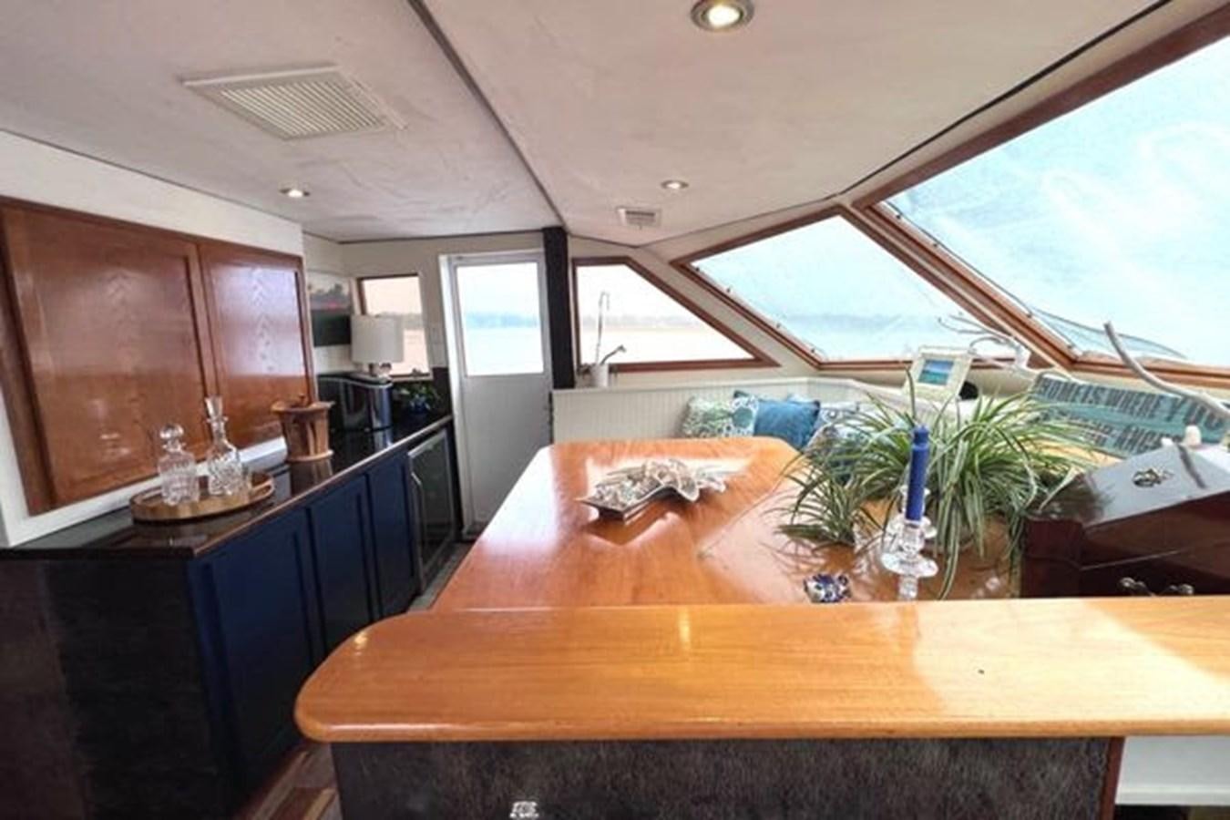 a kitchen with a large table aboard NORTHER VENTURE Yacht for Sale