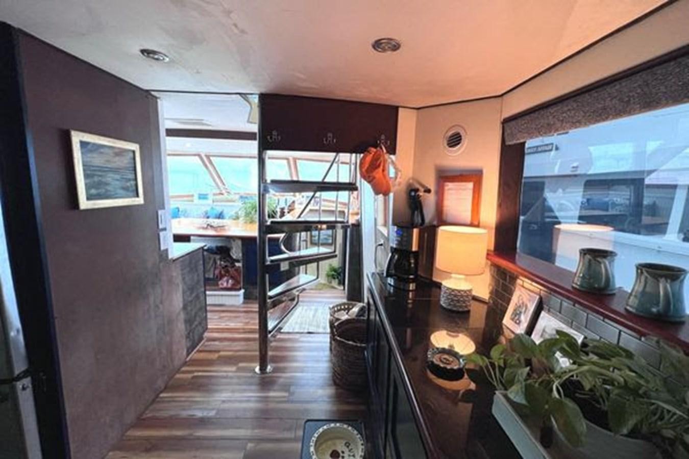 a room with a table and chairs aboard NORTHER VENTURE Yacht for Sale