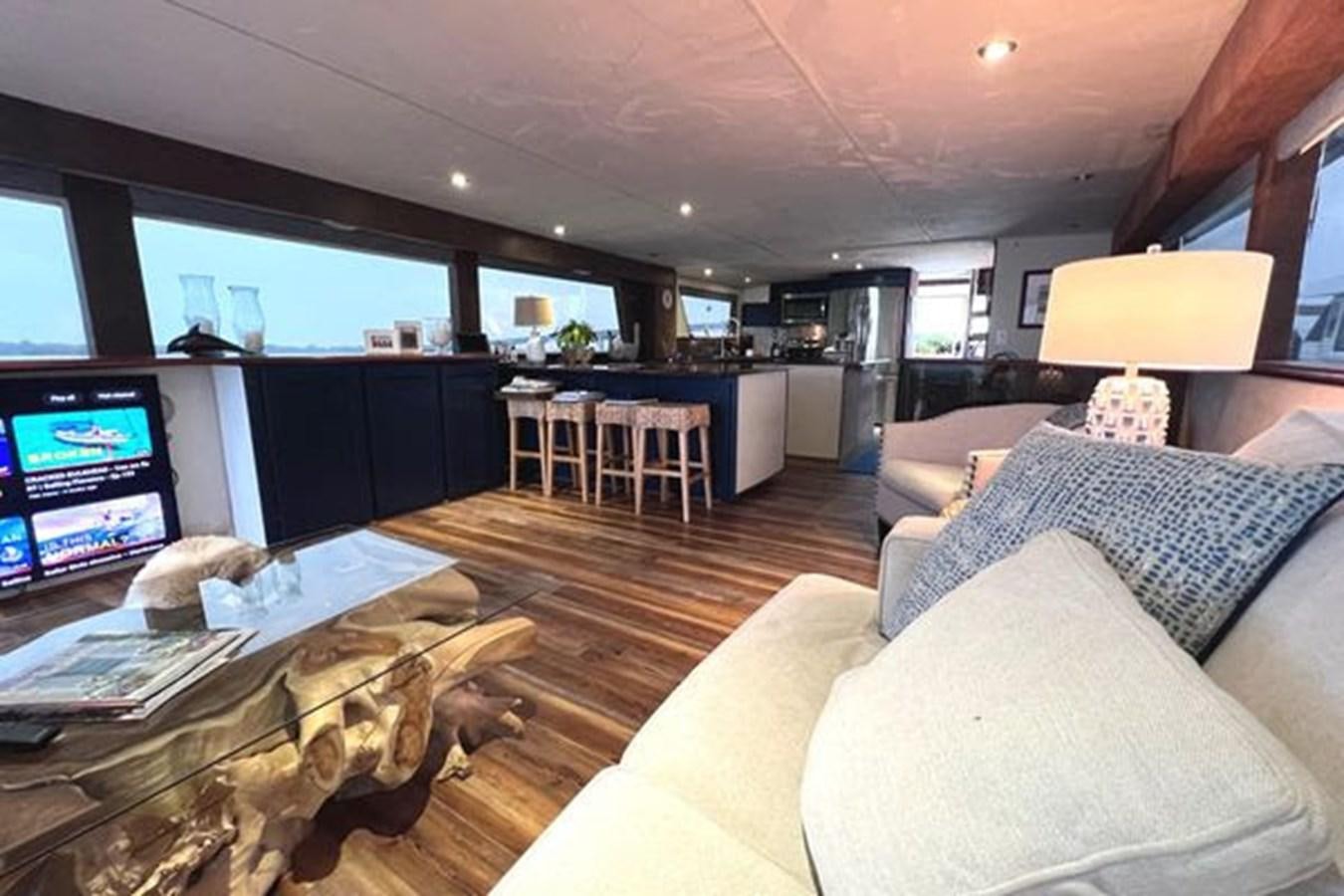 a living room with a large tv aboard NORTHER VENTURE Yacht for Sale