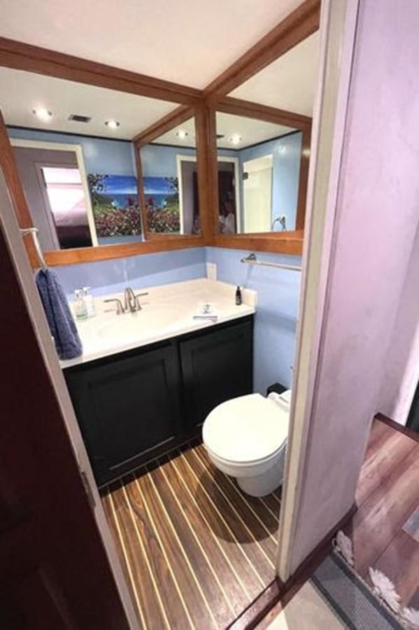 a bathroom with a sink and toilet aboard NORTHER VENTURE Yacht for Sale