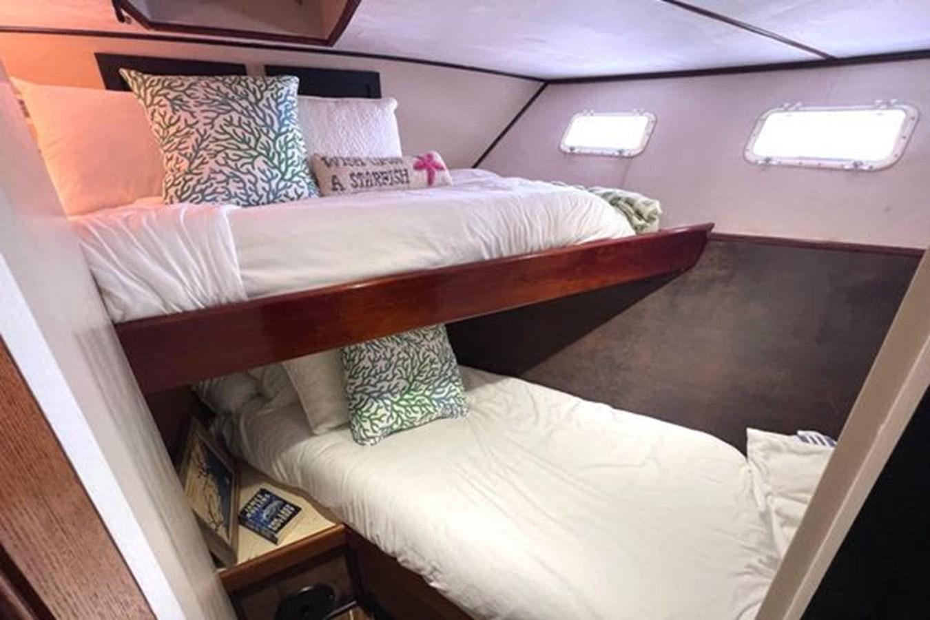 a bed with pillows aboard NORTHER VENTURE Yacht for Sale