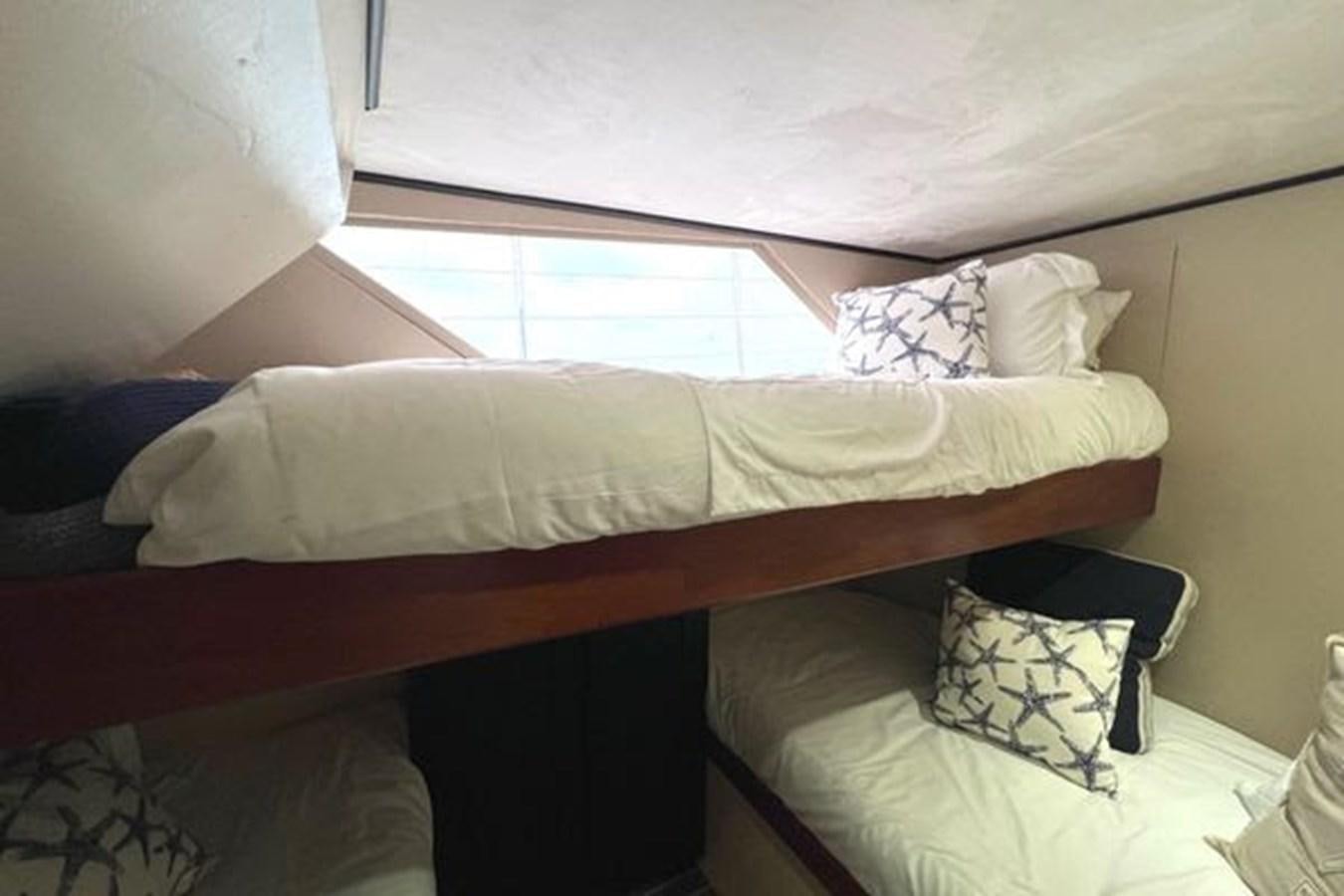 a bed with white sheets aboard NORTHER VENTURE Yacht for Sale