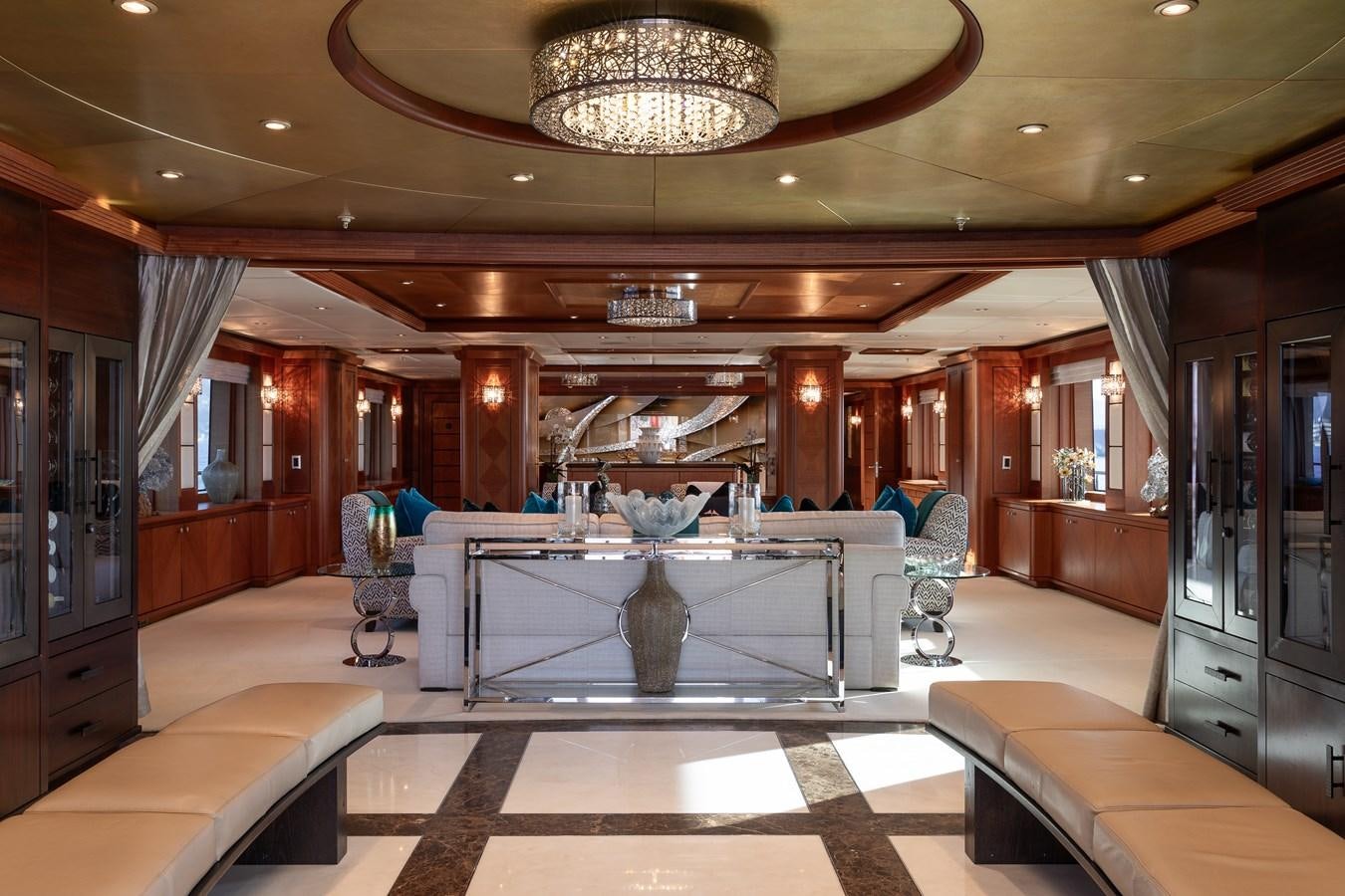 a room with a table and chairs aboard SKYFALL Yacht for Sale