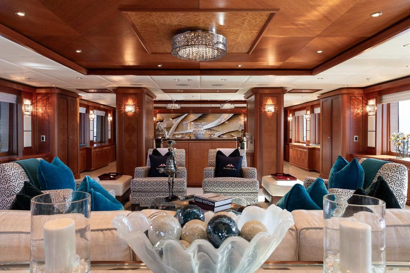 a large room with a group of people in it aboard SKYFALL Yacht for Sale