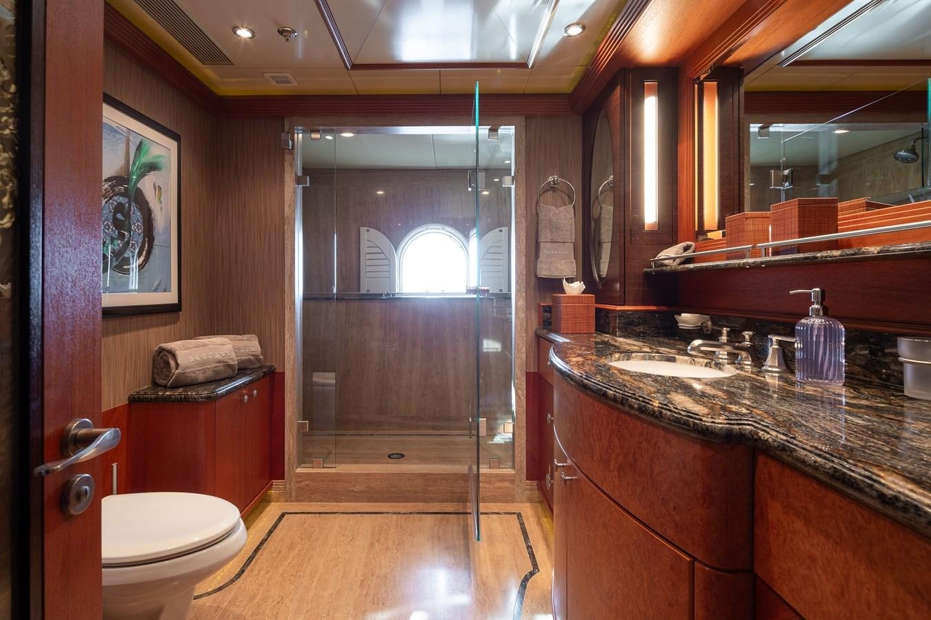 a bathroom with a large glass shower aboard SKYFALL Yacht for Sale