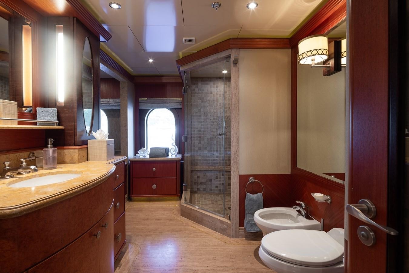a bathroom with a glass shower aboard SKYFALL Yacht for Sale