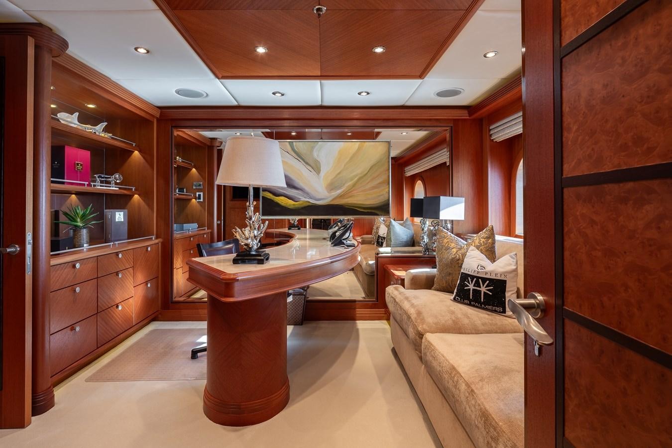 a living room with a table and a couch aboard SKYFALL Yacht for Sale