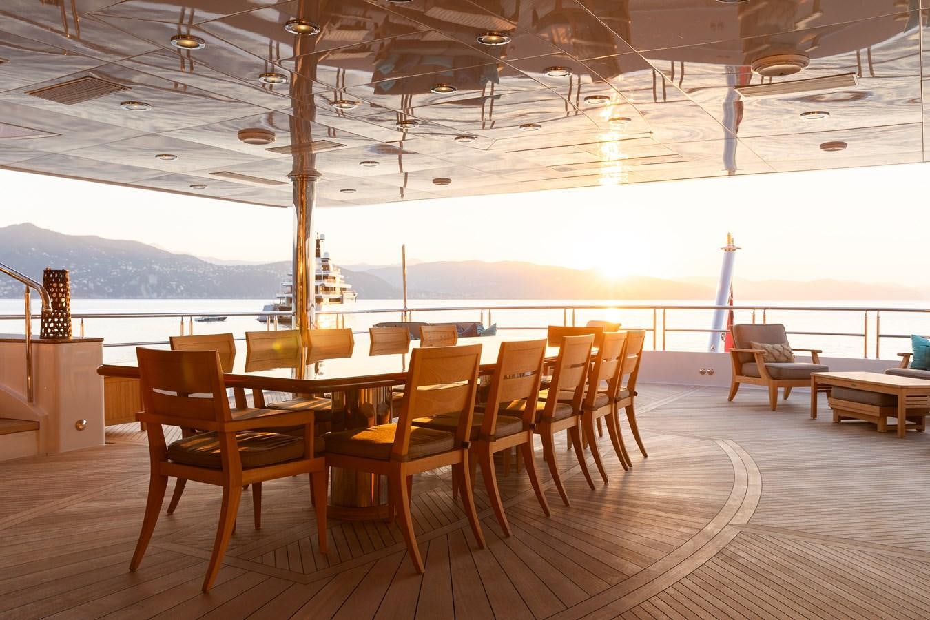 a room with a table and chairs aboard SKYFALL Yacht for Sale