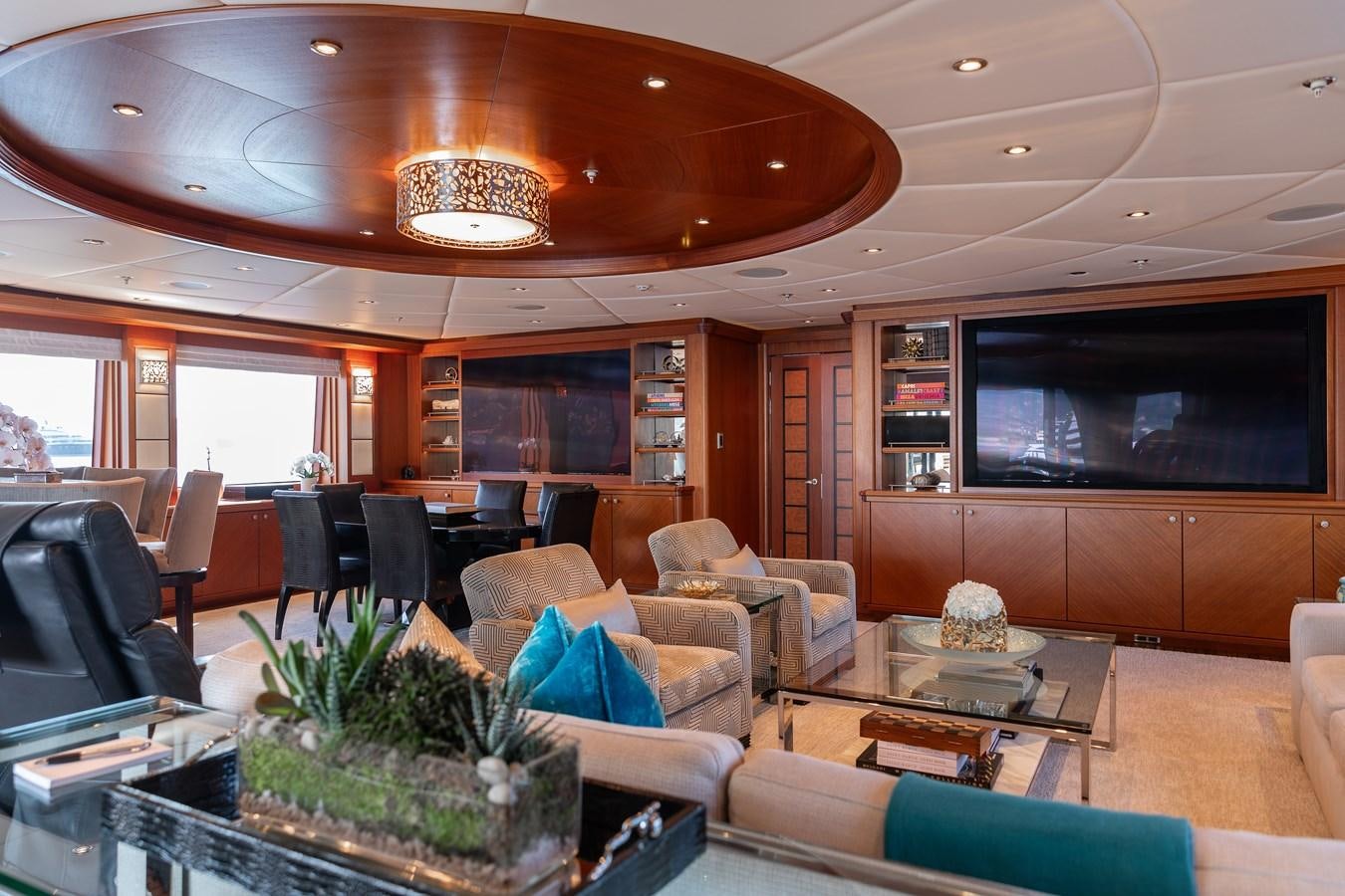 a living room with a large tv aboard SKYFALL Yacht for Sale