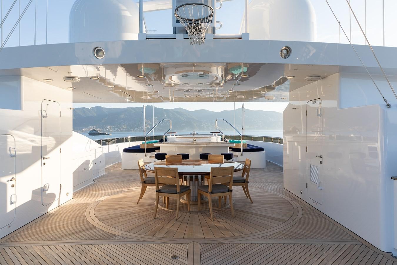 a room with a table and chairs aboard SKYFALL Yacht for Sale