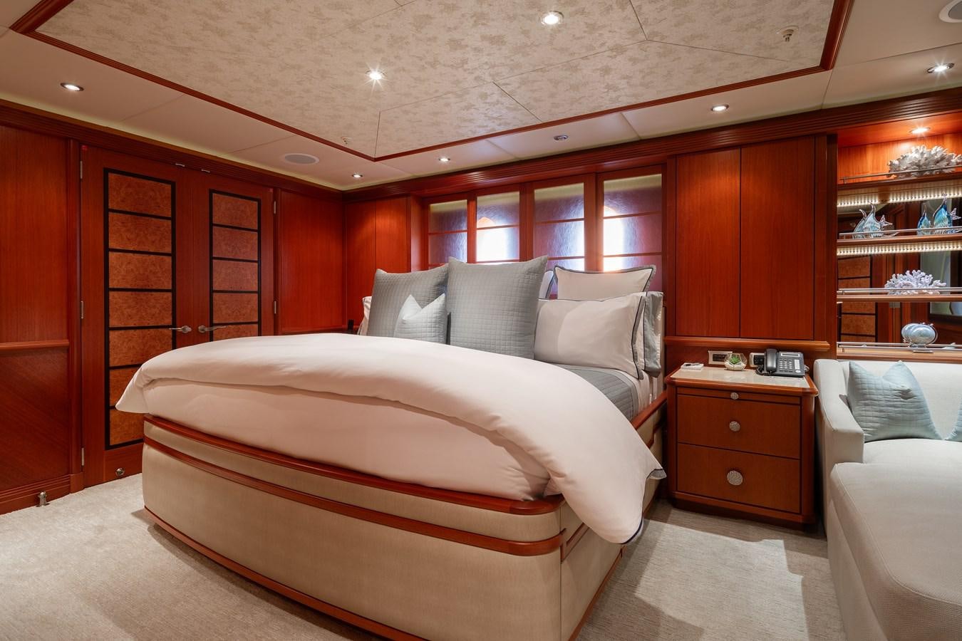 a room with a bed and a desk aboard SKYFALL Yacht for Sale