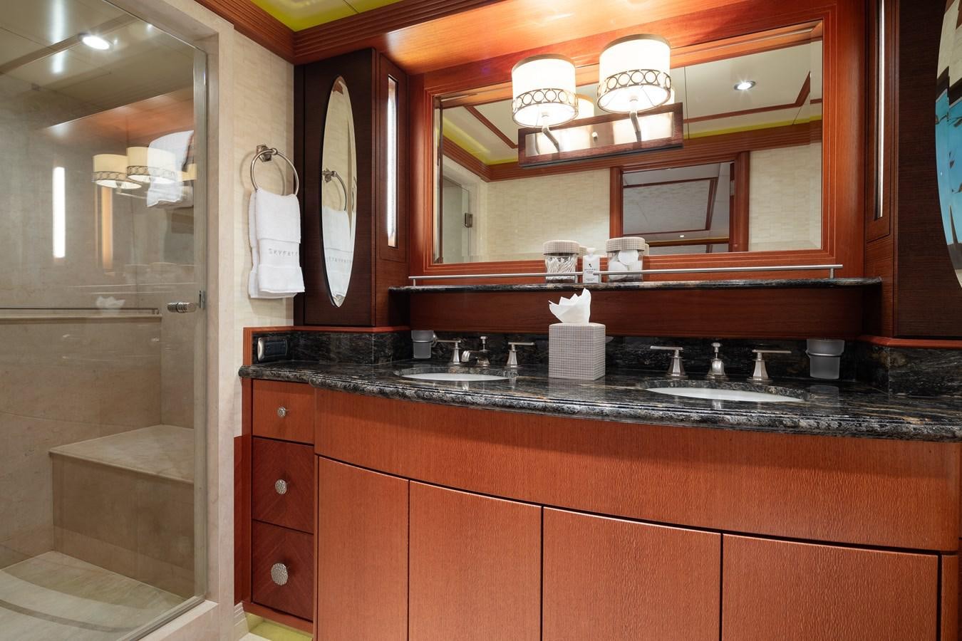 a kitchen with a large mirror aboard SKYFALL Yacht for Sale