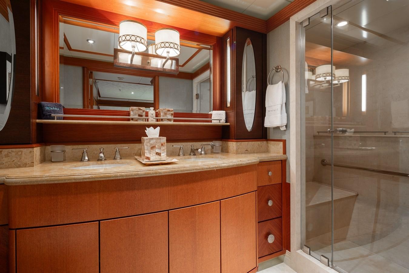 a bathroom with a large mirror aboard SKYFALL Yacht for Sale