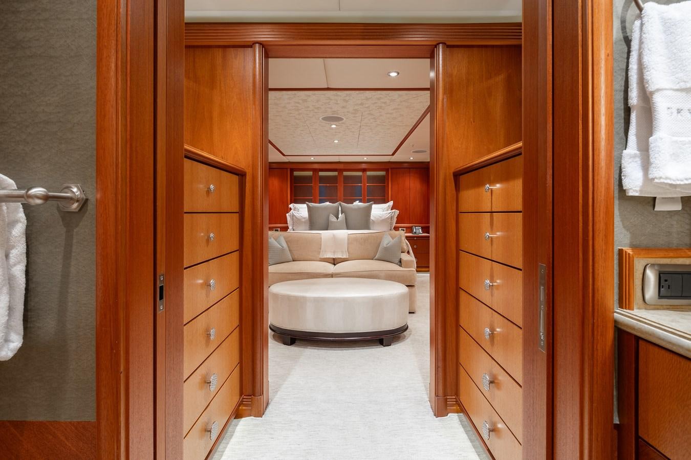 a room with a bed and a closet aboard SKYFALL Yacht for Sale