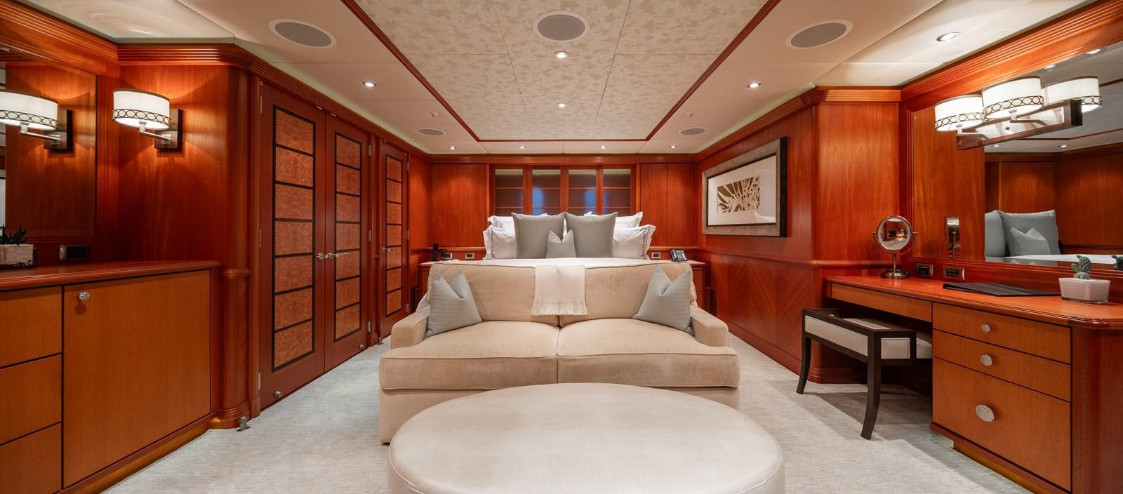 a room with a bed and a desk aboard SKYFALL Yacht for Sale